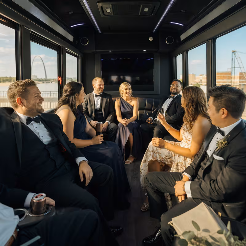 Wedding guests seated inside a St Louis party bus