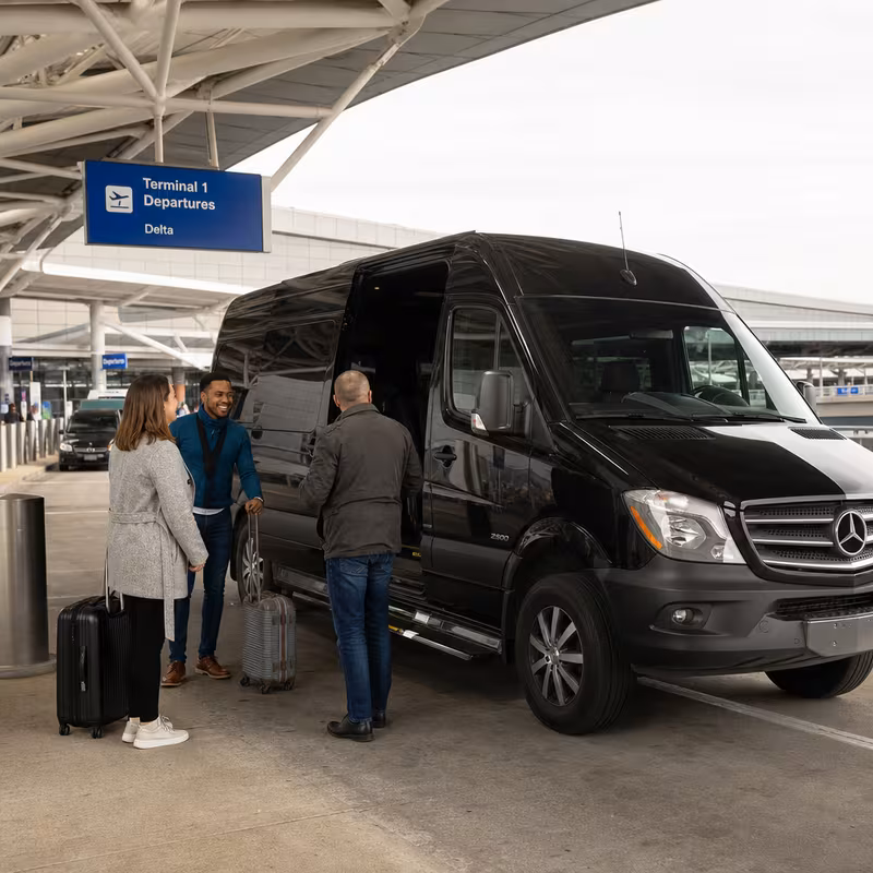 Group boarding a white charter bus for Airport Transportation transportation in St Louis