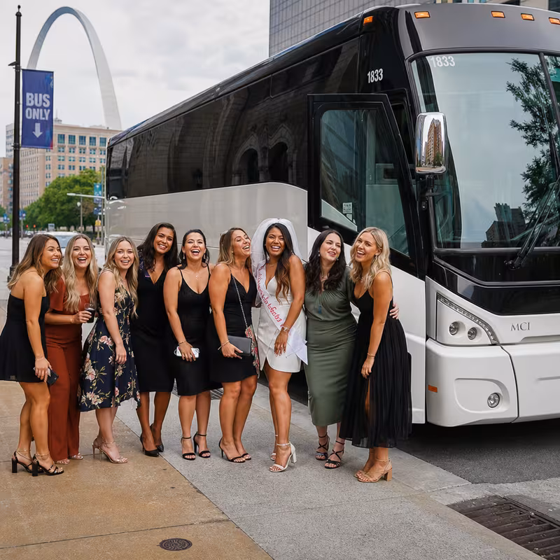 Passengers loading luggage while boarding an St Louis group shuttle