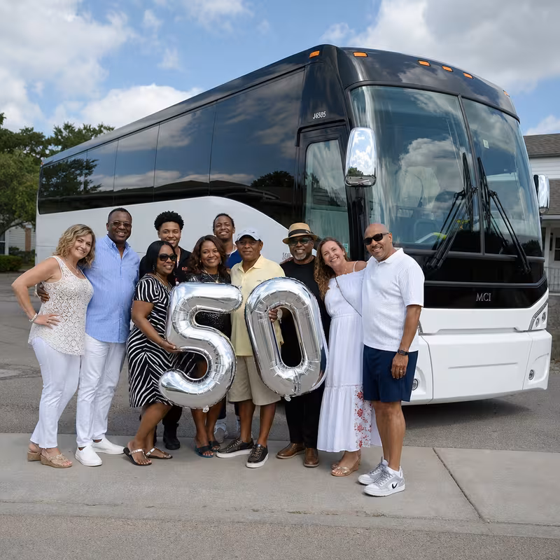 Passengers loading luggage while boarding an St Louis group shuttle