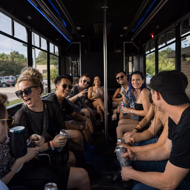 Passengers loading luggage while boarding an St Louis group shuttle