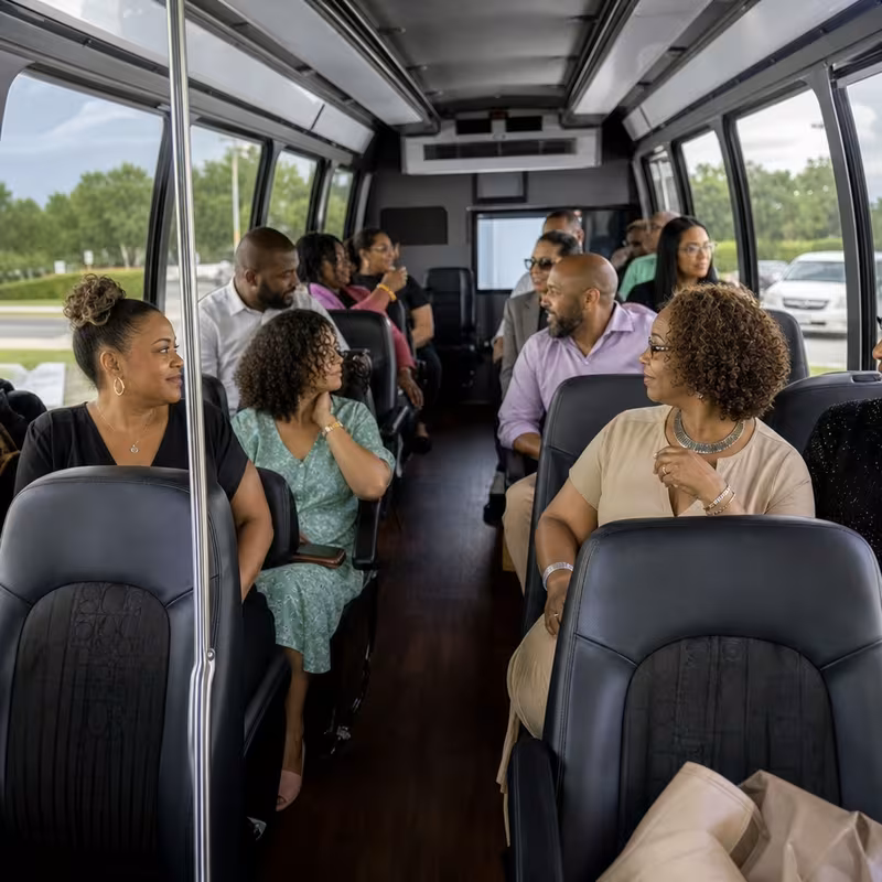 Group boarding a white charter bus for Private Event Transportation transportation in St Louis
