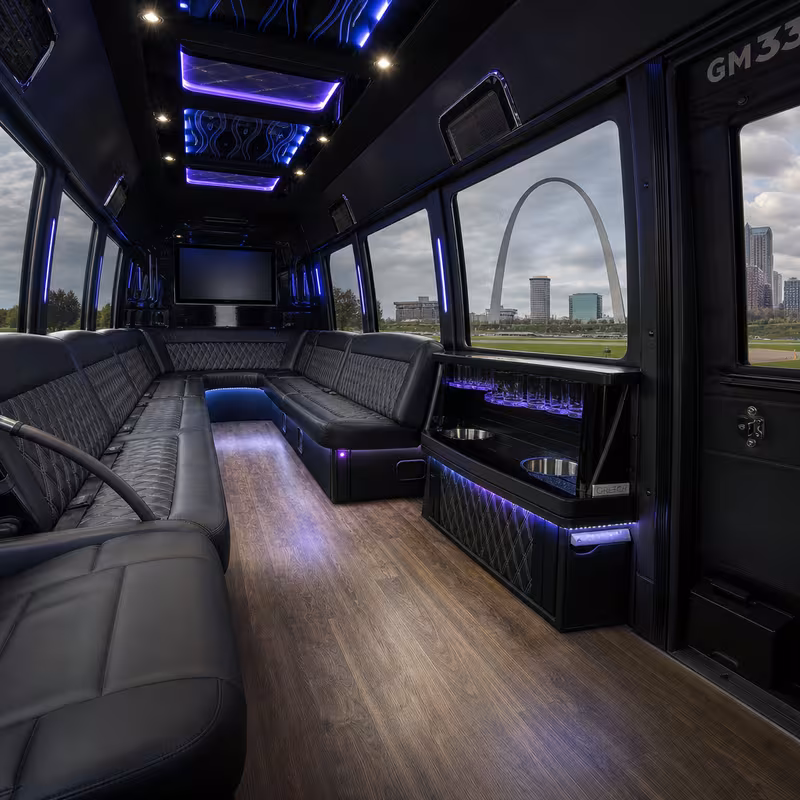 Party bus interior with wraparound leather seating and LED lighting in St Louis