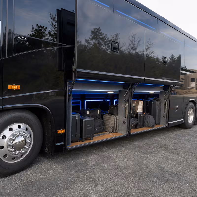 Party bus interior with wraparound leather seating and LED lighting in St Louis